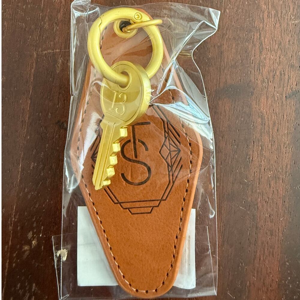 Taylor Swift NIB | The Life of a Showgirl Brass leather keychain TS logo TLOAS